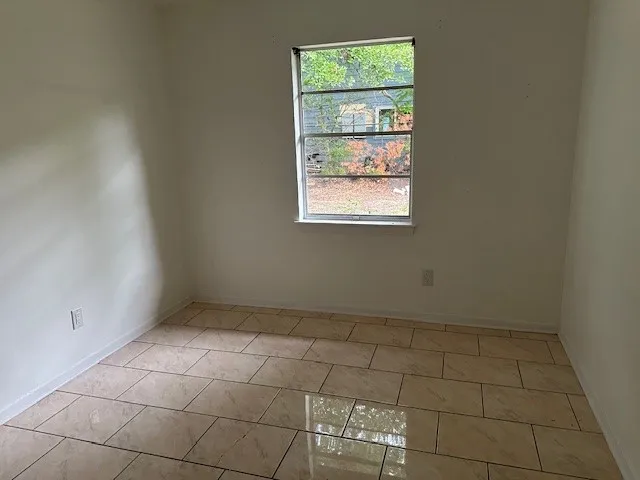 a view of an empty room and window