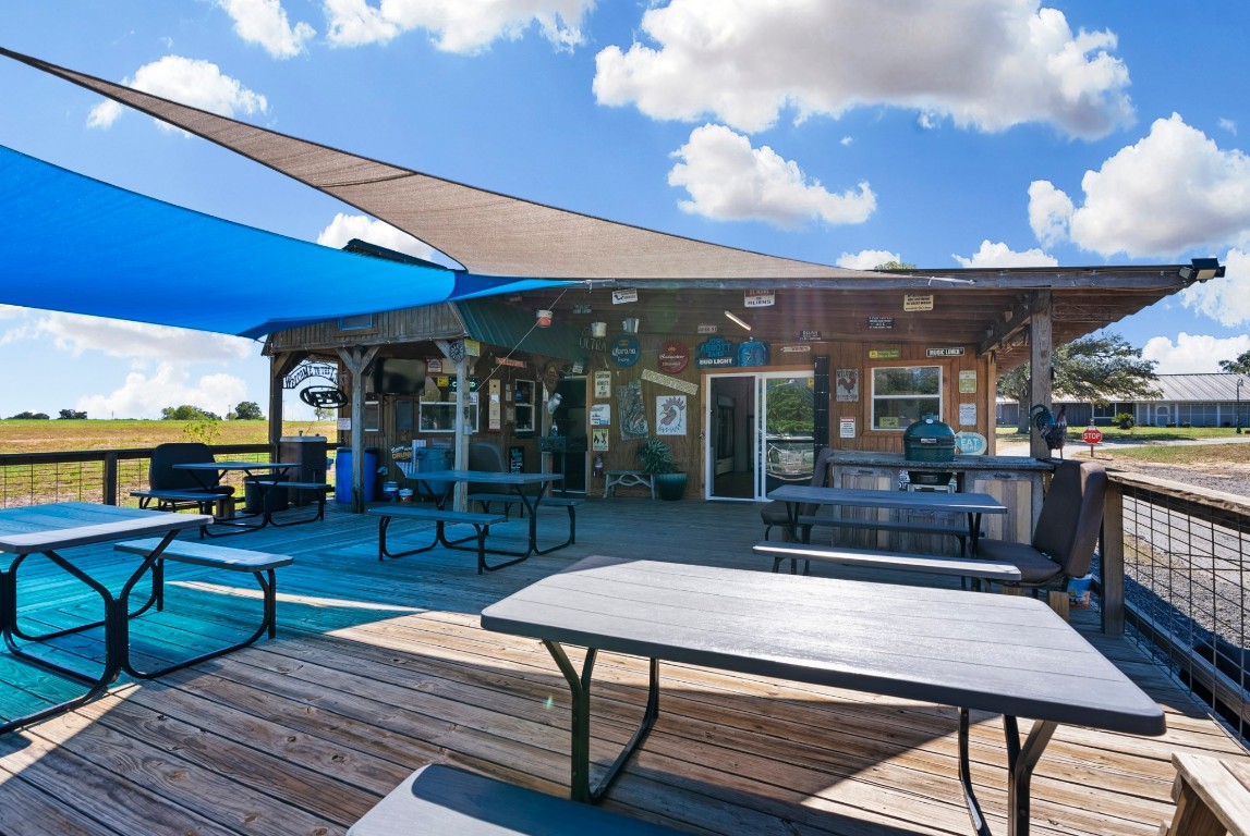 3777 San Marcos Highway Luling, TX 78648 - Photo 15 of 37 a living room with furniture a table and kitchen view