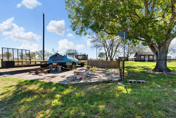 a room with musical instruments pool table and windows