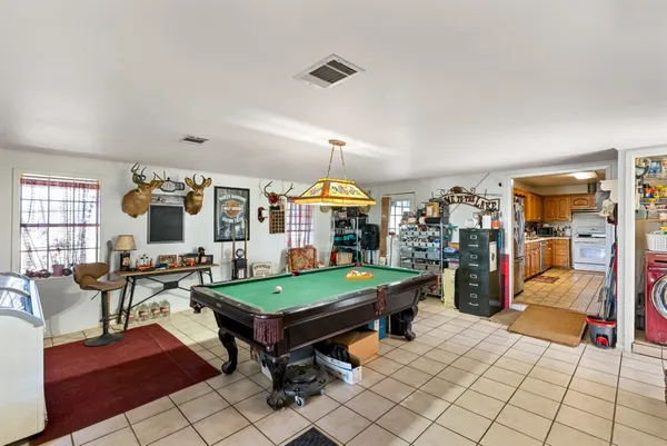 a kitchen with stainless steel appliances a stove sink and cabinets