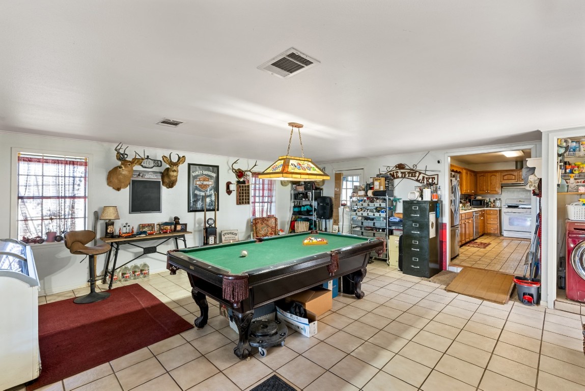 3777 San Marcos Highway Luling, TX 78648 - Photo 32 of 37 a living room with furniture a table and kitchen view