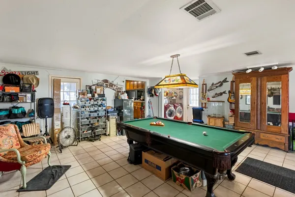 a living room with furniture large window and a fireplace