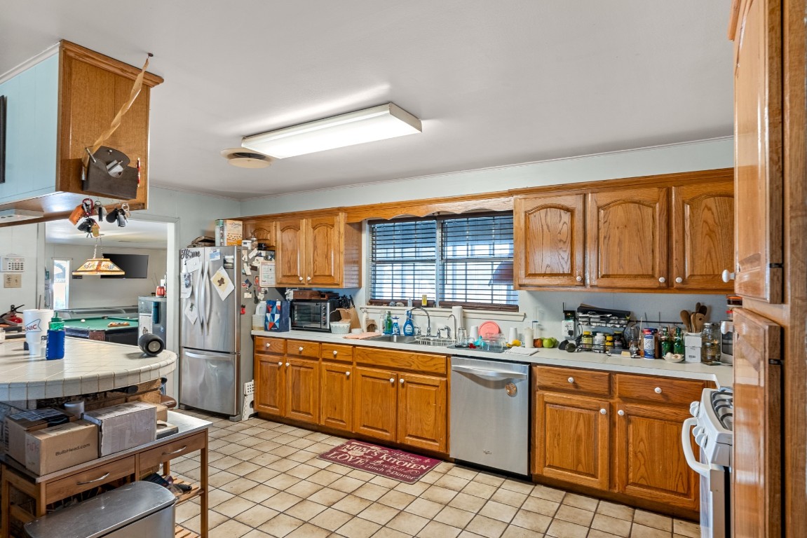 3777 San Marcos Highway Luling, TX 78648 - Photo 34 of 37 a kitchen with stainless steel appliances a stove sink and cabinets