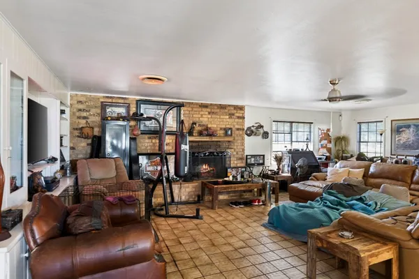 a bedroom with a bed a table and chair