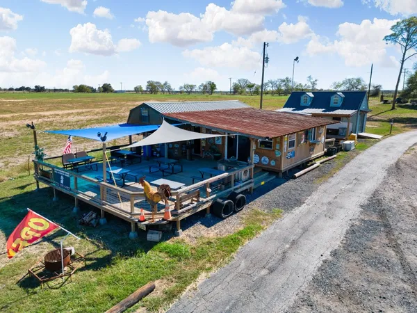 a view of swimming pool with a table and chairs