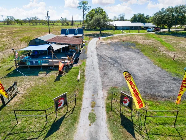 an aerial view of house with yard