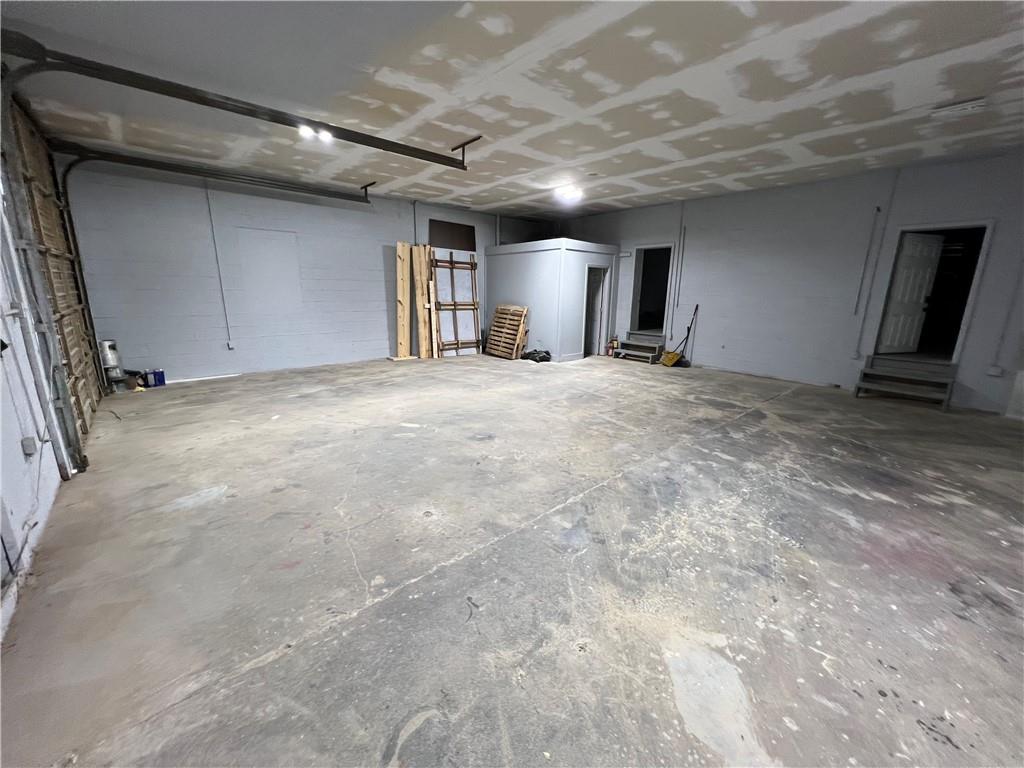 5536 Jackson Trail Road Hoschton, GA 30548 - Photo 12 of 41 a view of empty room with wooden floor