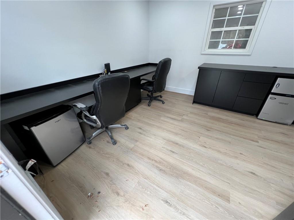 5536 Jackson Trail Road Hoschton, GA 30548 - Photo 2 of 41 a room with wooden floor and windows