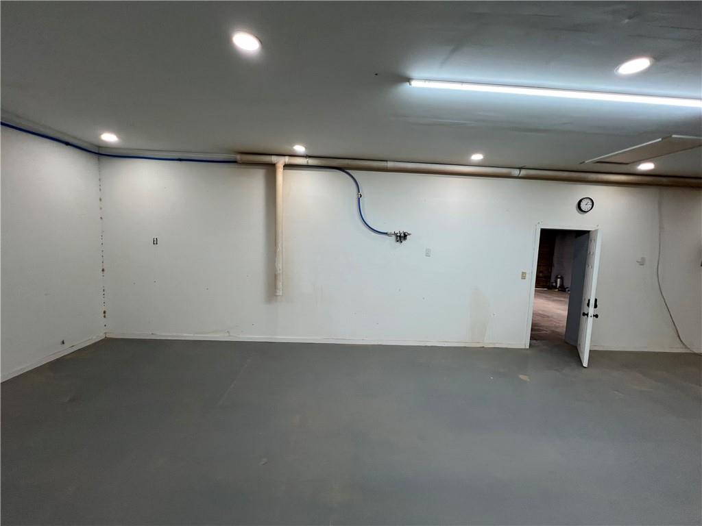 5536 Jackson Trail Road Hoschton, GA 30548 - Photo 32 of 41 an empty room with a projector and windows