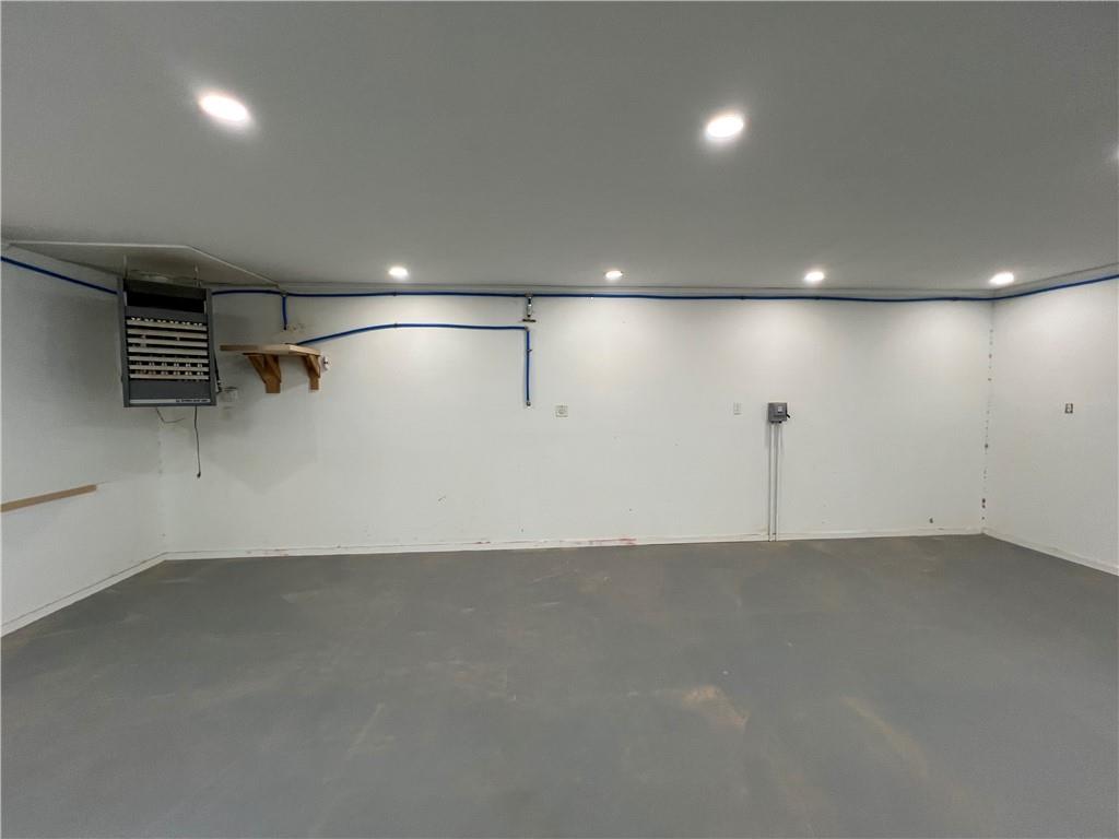 5536 Jackson Trail Road Hoschton, GA 30548 - Photo 33 of 41 an empty room with lot of shelves