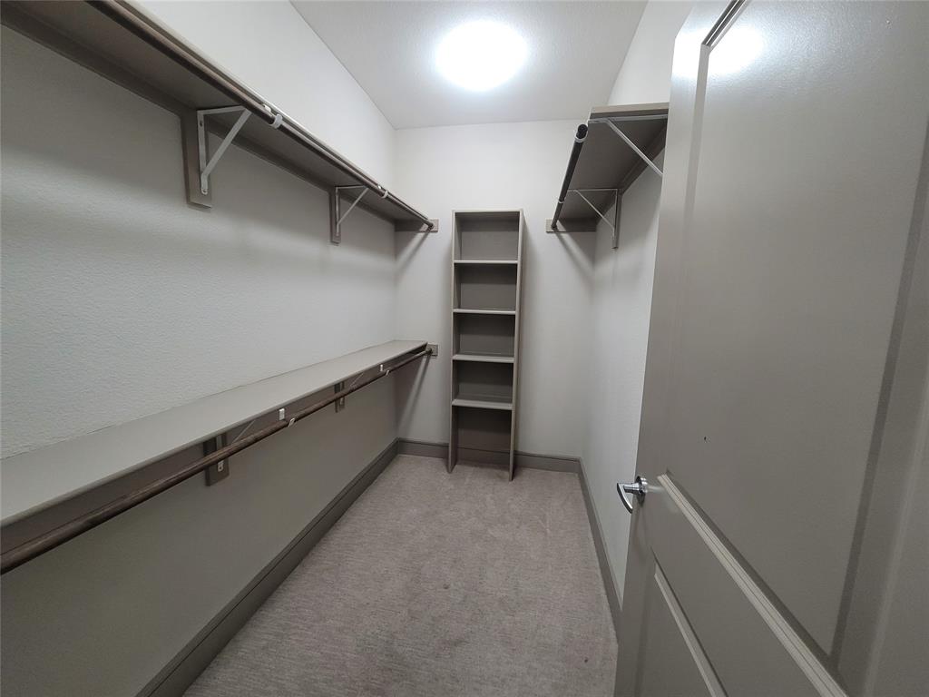 a view of an empty walk in closet