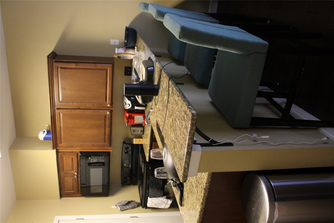 2801 Rio Grande Street, Unit 202 Austin, TX 78705 - Photo 14 of 38 a kitchen with a sink cabinets and appliances