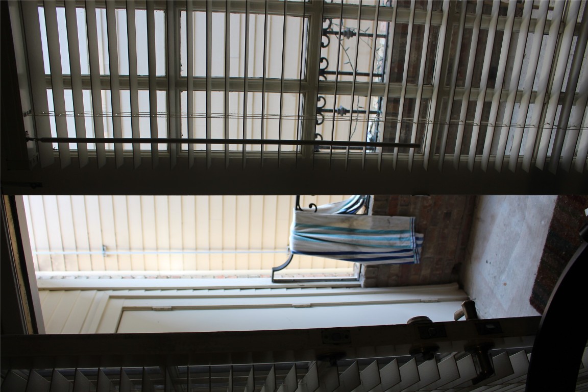 2801 Rio Grande Street, Unit 202 Austin, TX 78705 - Photo 17 of 38 a view of a balcony with chair