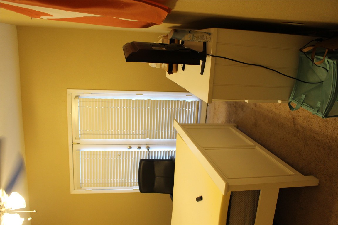 2801 Rio Grande Street, Unit 202 Austin, TX 78705 - Photo 20 of 38 a living room with a table chairs and a refrigerator
