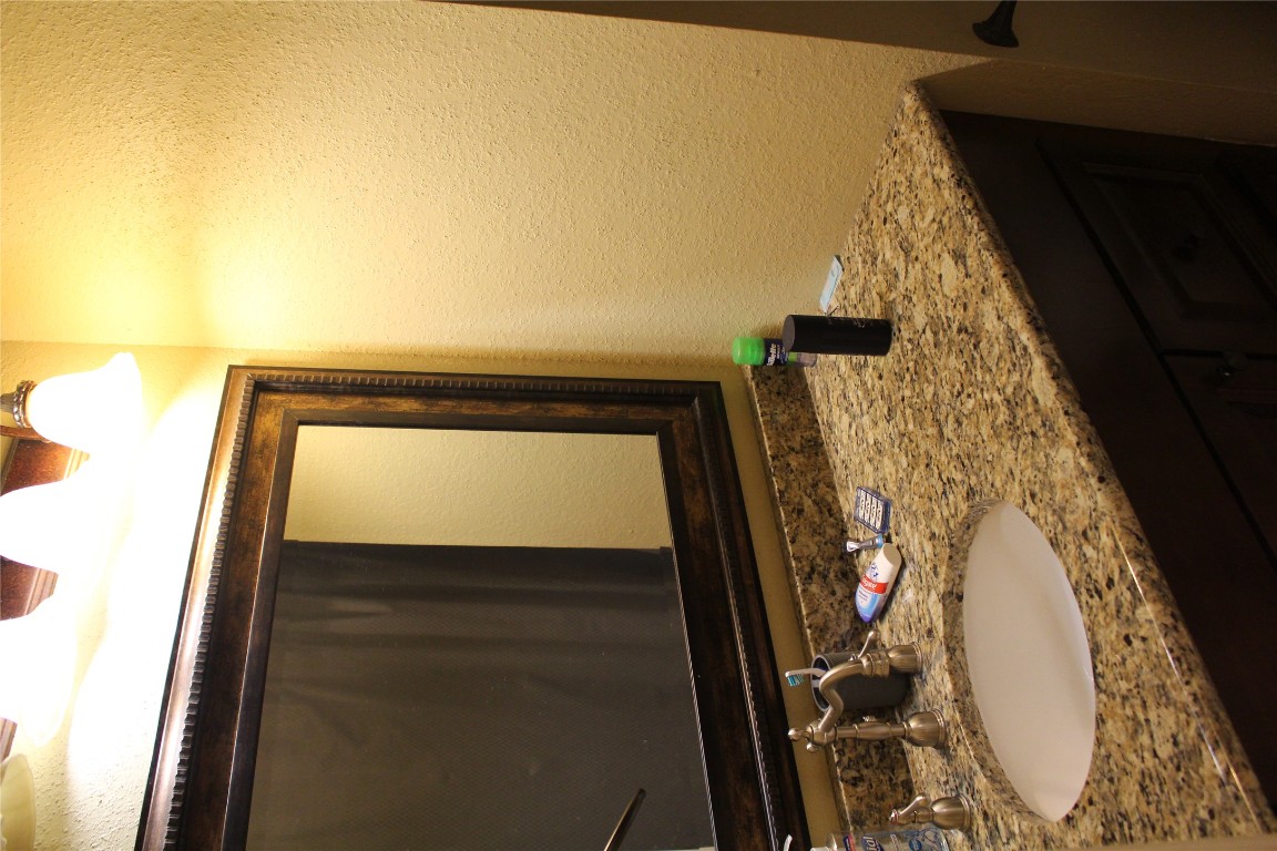 2801 Rio Grande Street, Unit 202 Austin, TX 78705 - Photo 21 of 38 a bathroom with a sink and a mirror