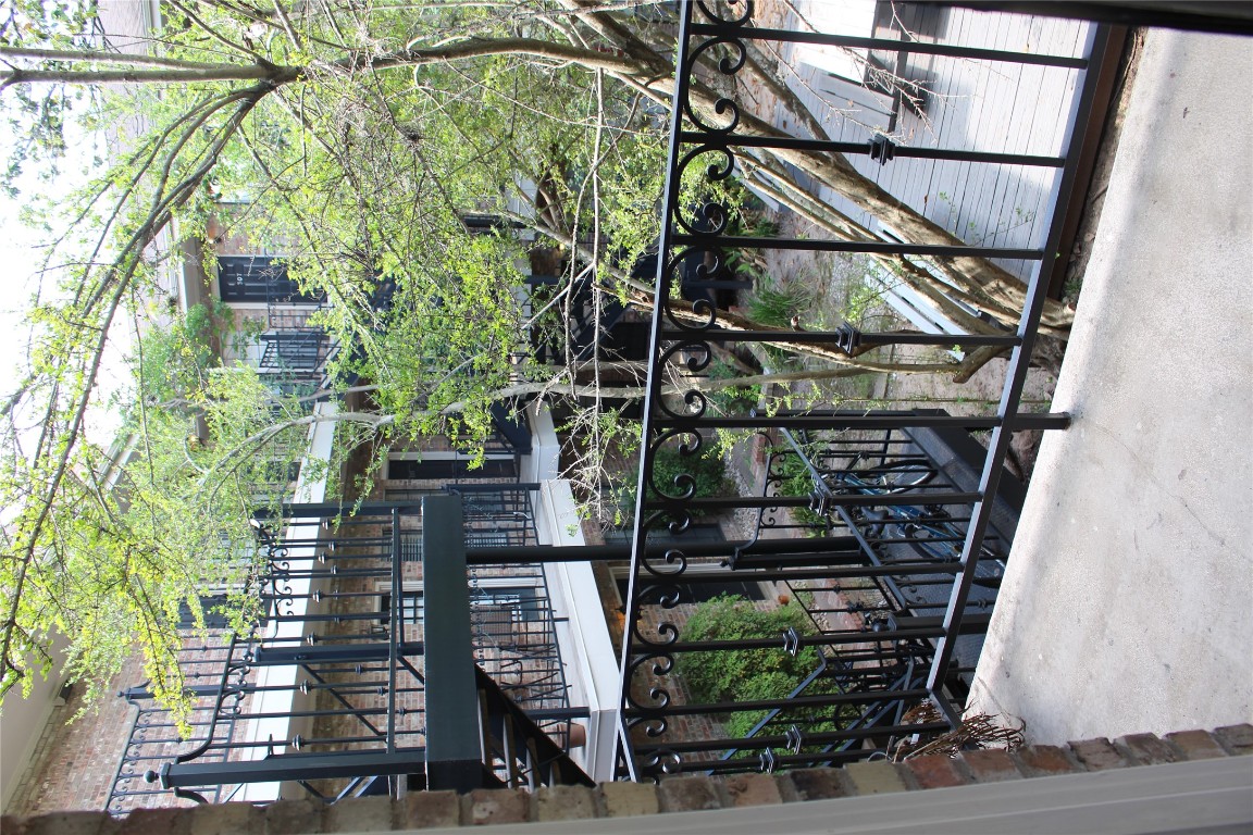 2801 Rio Grande Street, Unit 202 Austin, TX 78705 - Photo 26 of 38 a view of a house with backyard porch and sitting area