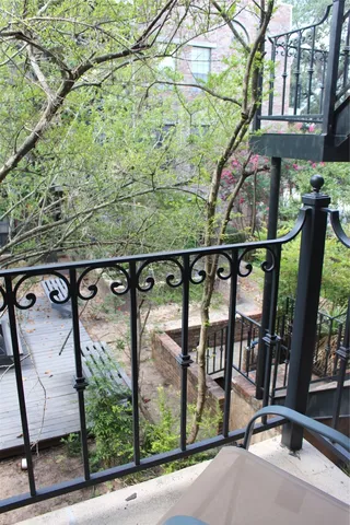 a view of a livingroom with furniture and a window