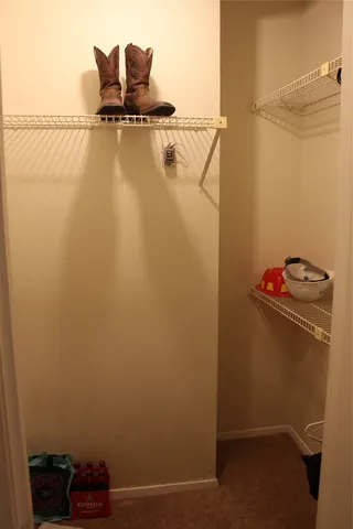 a bedroom with a bed and a fireplace