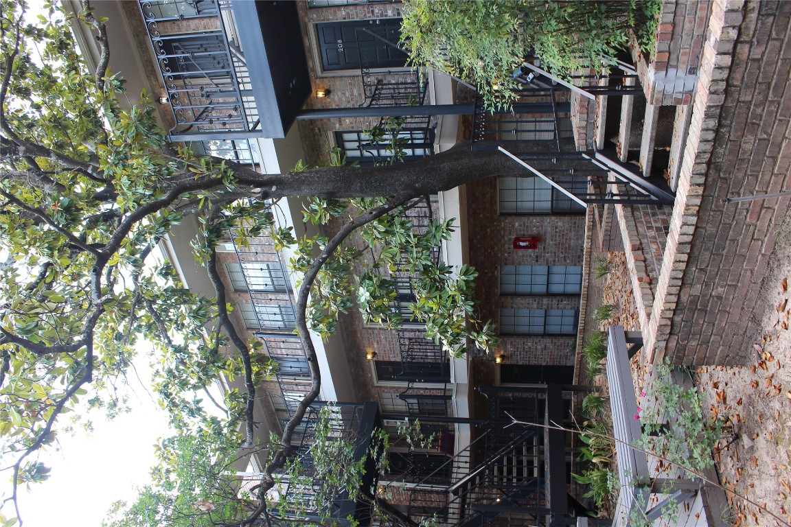 2801 Rio Grande Street, Unit 202 Austin, TX 78705 - Photo 34 of 38 front view of house with a street