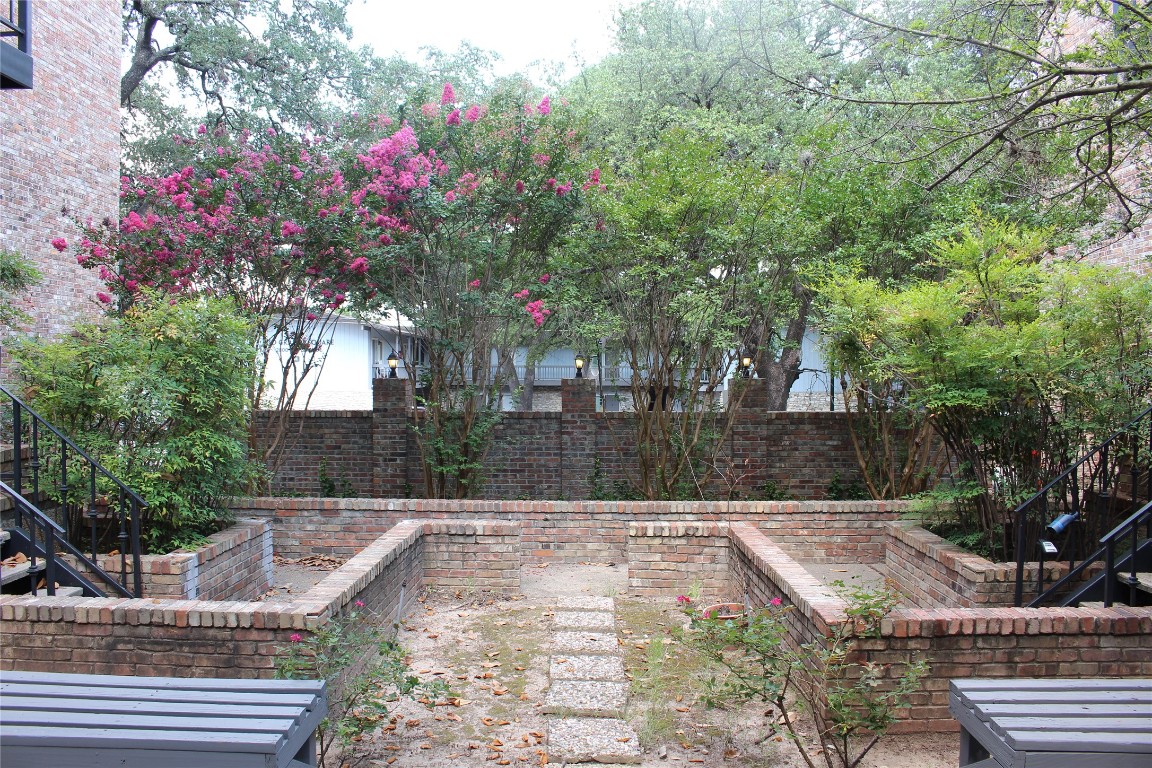 2801 Rio Grande Street, Unit 202 Austin, TX 78705 - Photo 35 of 38 a front view of a house with yard
