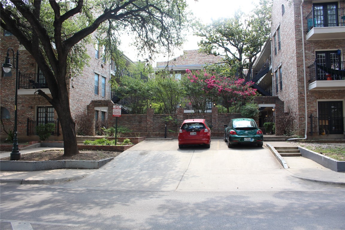 2801 Rio Grande Street, Unit 202 Austin, TX 78705 - Photo 38 of 38 a view of a cars park in front of a building