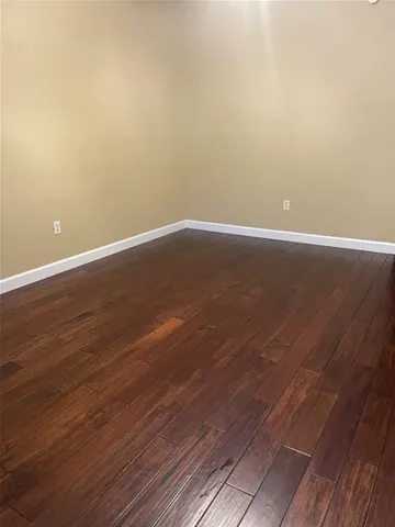 a living room with a table and a flat screen tv