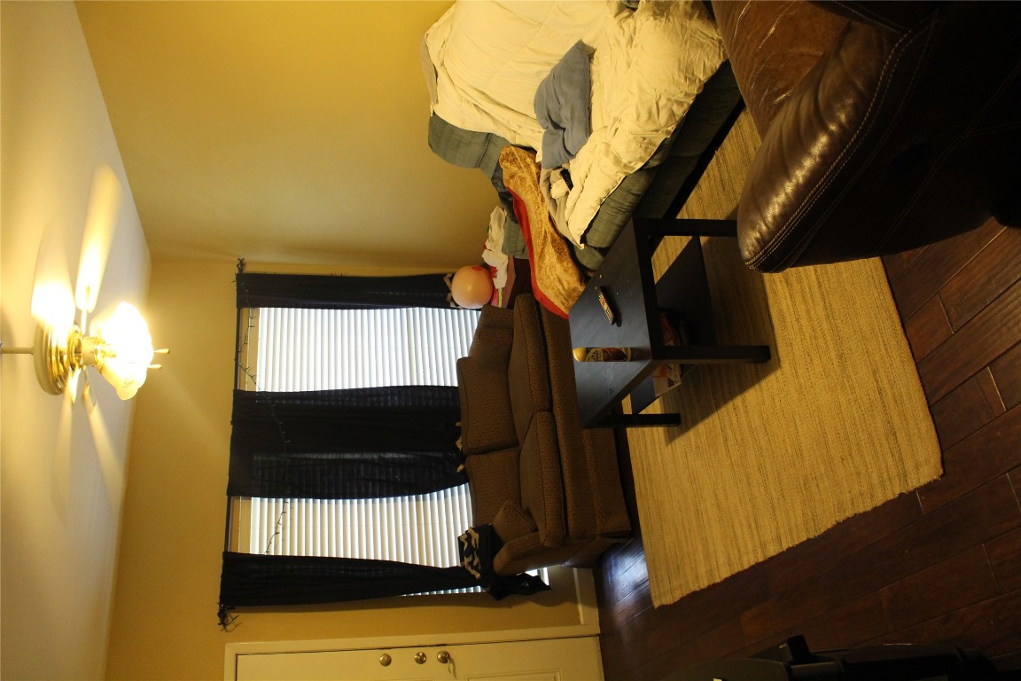 2801 Rio Grande Street, Unit 202 Austin, TX 78705 - Photo 10 of 38 a bedroom with a bed and window