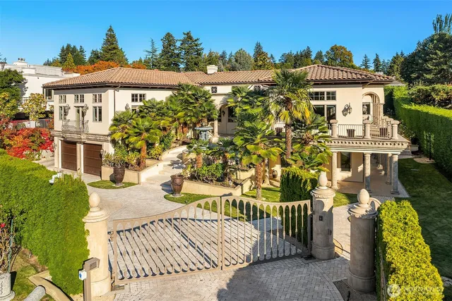 a view of a white house with a yard