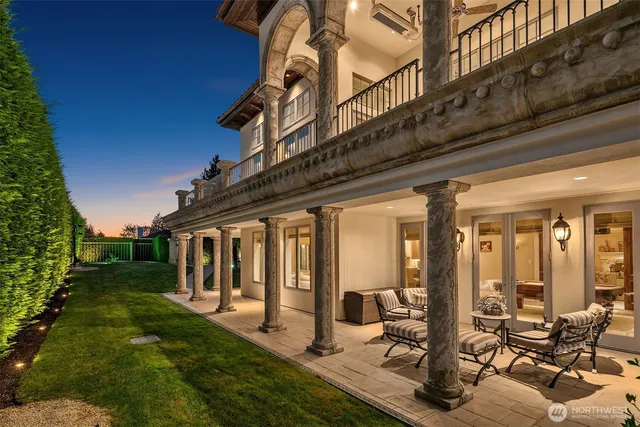 a view of a house with backyard porch and sitting area