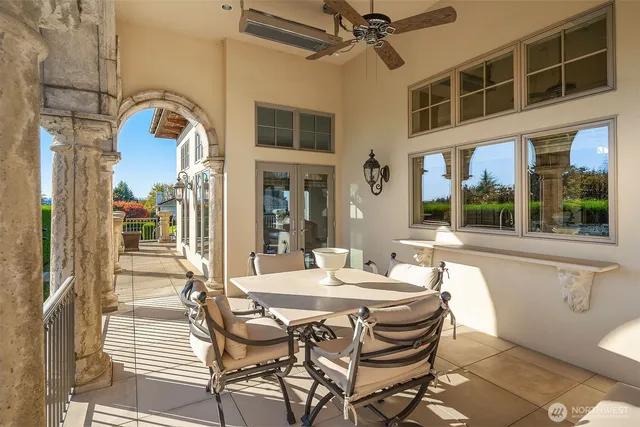 a dining room with a table and chairs