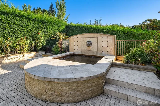 a bathroom with a mirror and a shower