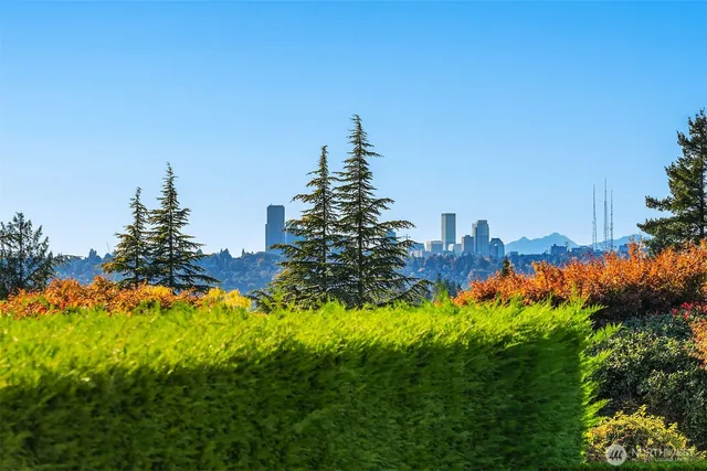a living room with patio furniture and a chandelier