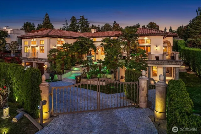 a view of a house with a small yard and plants