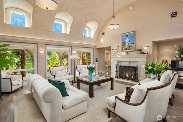 a kitchen with a sink and chairs