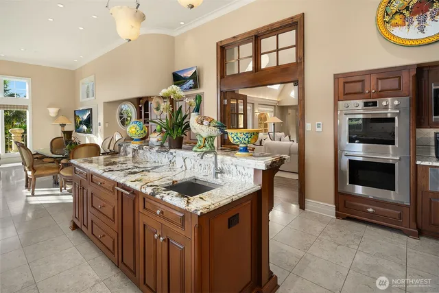 a view of a dining room with furniture large windows and wooden floor