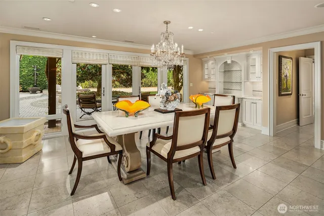 a living room with furniture a rug and a chandelier