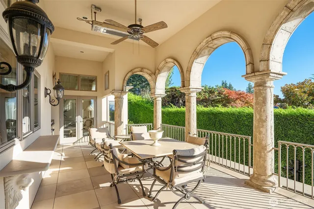 a view of a patio with table and chairs