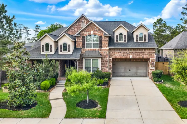 $675,000 | 210 Chirping Squirrel Court, Pinehurst, TX 77362