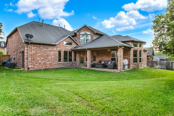 $675,000 | 210 Chirping Squirrel Court, Pinehurst, TX 77362