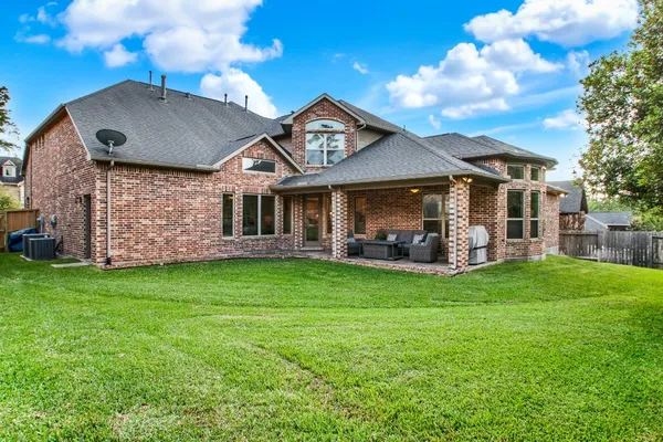 $675,000 | 210 Chirping Squirrel Court, Pinehurst, TX 77362