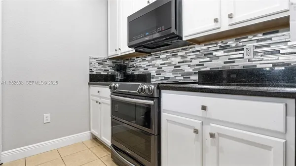 a kitchen with a stove and a microwave