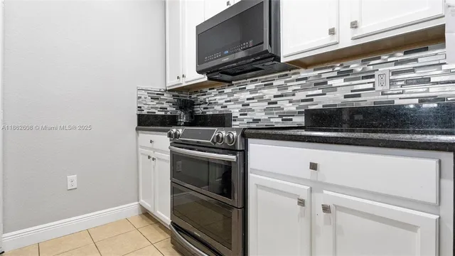 a kitchen with a stove and a microwave