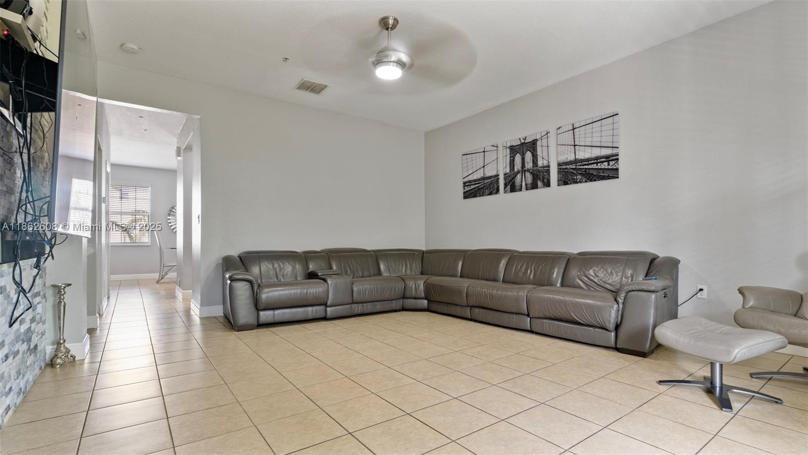 2547 Southwest 119th Terrace Miramar, FL 33025 - Photo 14 of 41 a living room with furniture and a couch