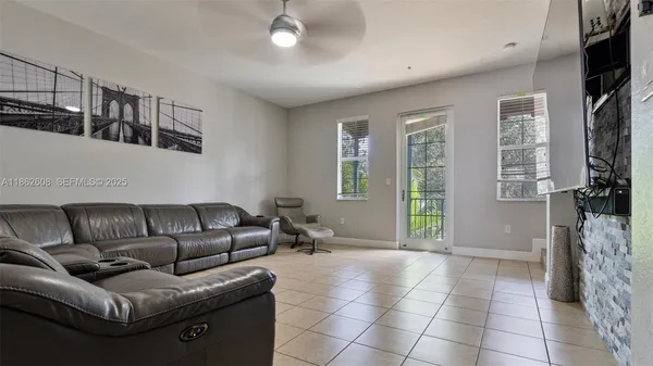 a living room with furniture and a flat screen tv
