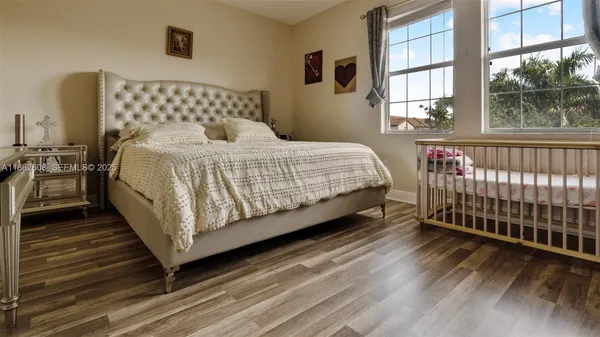 a bedroom with a bed and window