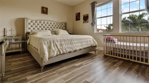 a bathroom with a bathtub sink and mirror