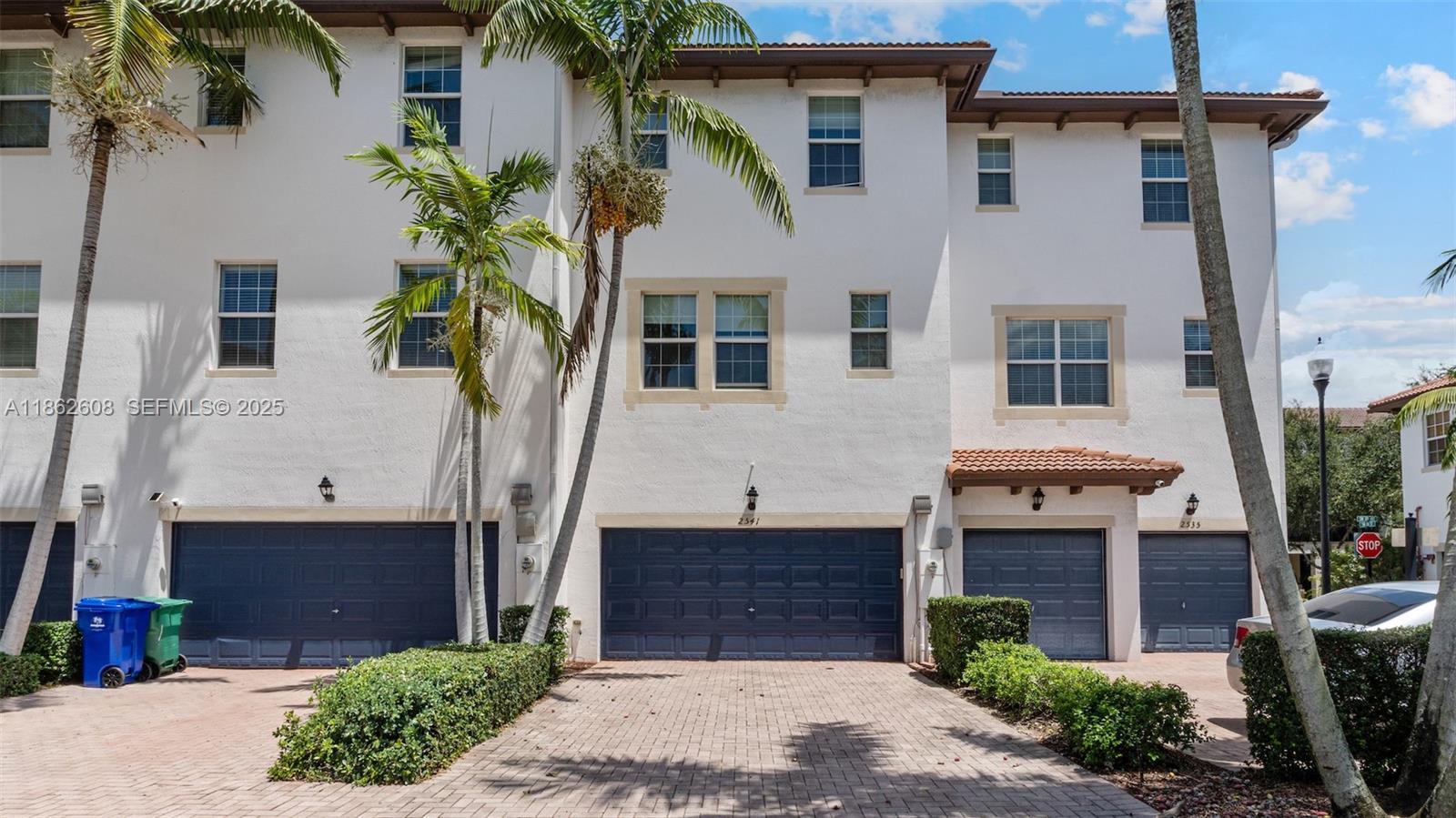 2547 Southwest 119th Terrace Miramar, FL 33025 - Photo 31 of 41 a front view of a house with a yard