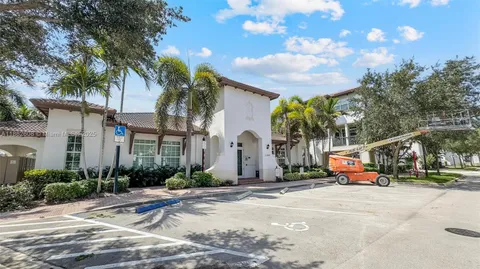 swimming pool view with a seating space
