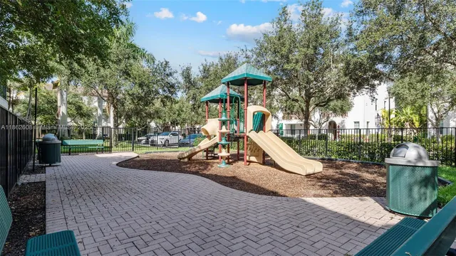 an aerial view of residential houses with outdoor space and swimming pool
