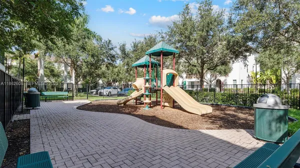 a view of a park with large trees